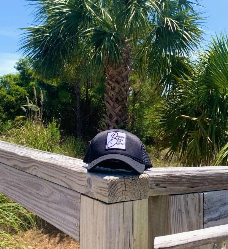 a hat on a wooden fence