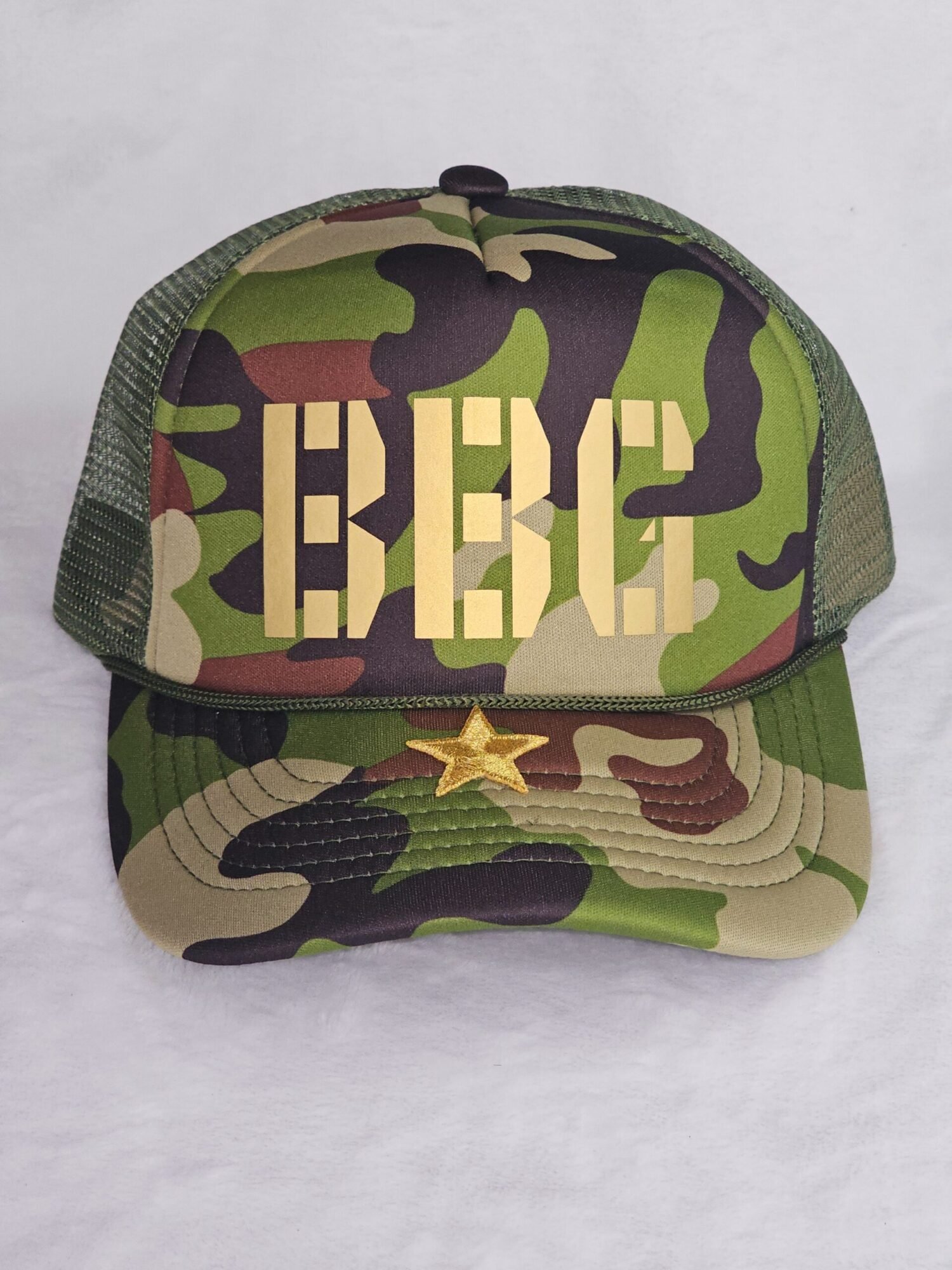 a camouflage hat with a star on it